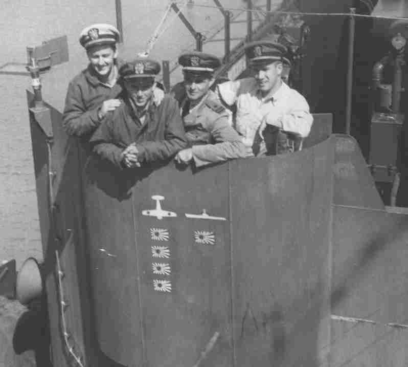 Photo of four USS Rall officers