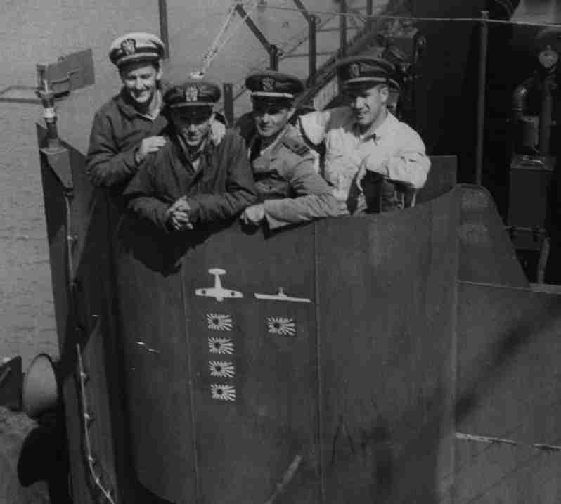 Photo of four officers from USS Rall